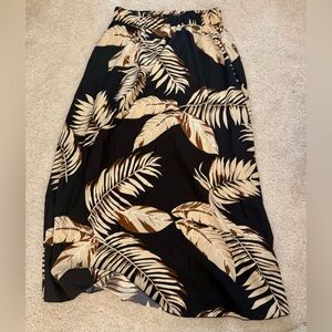 NWOT Petite Midi Black Skirt w/ Tropical Print. Slit on Side. Elastic Waist
